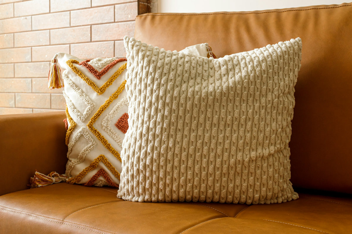 Cozy living room with a caramel sofa and soft pillows